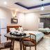 Ossanzaia Bilene Lodge in Bilene: guest room with two beds, round table and chairs, mirrored wardrobe