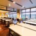 Dormy Inn Premium Kyoto Ekimae Natural Hot Spring dining area with large windows and tables in Kyoto