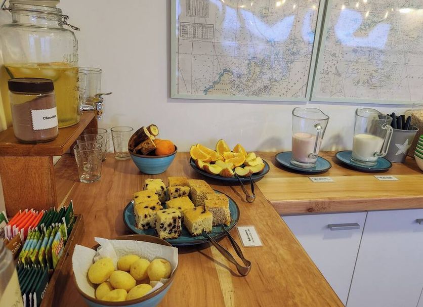 Hosteria Aonikenk Ushuaia breakfast buffet with pastries, fruit, juice, coffee and tea