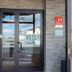 Hôtel L'Europe entrance with glass doors and stone facade in Cholet