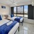 Royal Palm Resort in Palm Beach guest room with two beds and large city-view windows