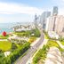 Sea Shore Garden Hotel Qingdao in Qingdao with oceanfront park, beach, and city skyline view