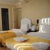 Lotus Hotel Istanbul triple room with three single beds and yellow bedding