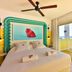 Paradiso Ibiza Art Hotel - Adults Only room with colorful headboard and balcony overlooking Sant Josep de sa Talaia
