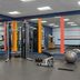 Hampton Inn Turlock fitness room with weights, exercise machines, and stability balls