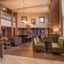 Hampton Inn & Suites Boise-Meridian lobby with seating area, fireplace, and bar-style tables in Meridian