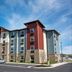 My Place Hotel - West Valley City, UT exterior with stone accents and parking lot