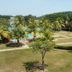 Hotel Seri Malaysia Kulim in Kulim with a palm-lined lawn, swimming pool, and hillside view