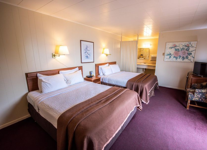Northwinds Motel in Mackinaw City guest room with two double beds and a small TV