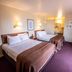 Northwinds Motel in Mackinaw City guest room with two double beds and a small TV