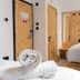 Easyhotel Paddington London room with wooden bunk-style beds and folded towels