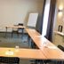 Hotel Friedrichstraße Lampertheim meeting room with U-shaped conference tables and flip chart