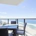 Rhapsody Resort Surfers Paradise balcony with table, chairs and ocean view over the beach