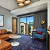 The Rally Hotel at McGregor Square in Denver, stylish suite with sofa, balcony doors and city view