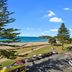 Pavilion Beachfront Apartments in Mount Maunganui overlooking the beach, road and parked cars