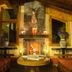 Huerta Real Mazamitla in Mazamitla: rustic lounge with fireplace, wooden beams and orange sofas