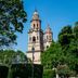 Fiesta Inn Morelia Altozano in Morelia with a view of a historic cathedral and green park