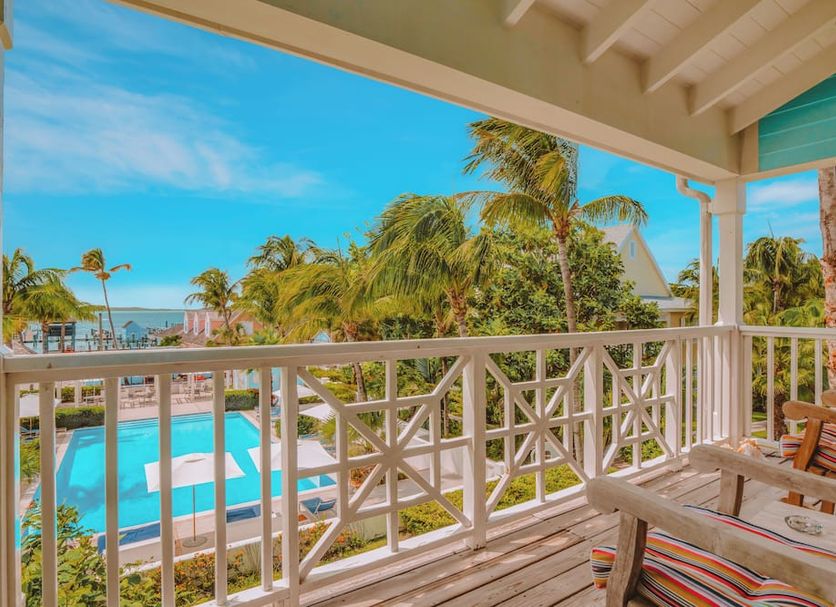 Valentines Resort & Marina in Dunmore Town balcony with pool, palm trees and ocean view