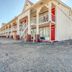 OYO Hotel Waco University Area/ I-35 in Waco exterior with two-story balconies and gravel parking lot