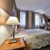 Hotel Spa Wieniawa in Rekowo Górne guest room with sloped ceiling, skylight, desk and twin lamps