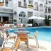 Kronos Hotel, Platamon: outdoor pool with loungers and terrace seating beside the white hotel building