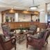 Royal Floridian Resort by Spinnaker in Ormond Beach lobby seating area with wood chairs and reception desk