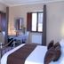 Royal Palace Luxury - Piazza di Spagna room in Rome with bed, vanity, TV and two windows