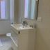 Mamma Ciccia in Mandello del Lario bathroom with sink, mirror, toilet, and towel rack