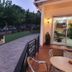 Hotel La Costera in A Lanzada: terrace walkway beside garden and entrance at dusk