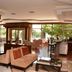 Anemon Ege Hotel in Izmir lobby lounge with seating and large windows overlooking greenery