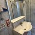 Contact Hôtel les Platanes Villeneuve sur Lot Centre bathroom with shower, sink and mirror in Villeneuve-sur-Lot