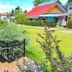 The Scenery Beach Resort in Ko Pha Ngan with landscaped gardens and colorful bungalow cottages