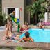 Ipanema Beach House in Rio de Janeiro with a small outdoor pool and guests lounging poolside