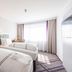Premier Inn Stuttgart Airport room with two twin beds, large window and curtains in Leinfelden-Echterdingen