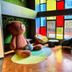 Yiting Huicheng Hotel Xiamen lobby with giant teddy bear seating and colorful stained-glass windows