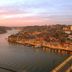 Golden Tulip Porto Gaia in Vila Nova de Gaia with sunset river and city views over a lit bridge