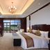New Century Hotel Guian Guizhou in Anshun guest room with balcony and floor-to-ceiling windows