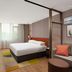 Home2 Suites by Hilton Xishuangbanna Jinghong room with bed, sofa, desk and large window