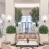 Fairmont La Marina Rabat-Salé lobby lounge in Rabat with tall trees, seating and marble tables