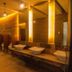 Big Hotel Suites Mandaue City bathroom with double sinks, warm lighting and mirrors