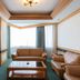 Sunshine Airport Hotel in Zhuhai living room with tan leather sofas and bay window seating
