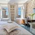 Heritage Hotel Antique Split guest room with bed, stone walls, windows, and city view in Split