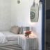 Hua Plee Lazy Beach Hotel in Hua Hin, a simple room with a single bed, bedside table, and wall art