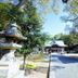Apa Hotel Yamaguchi Hofu in Hōfu with a tree-lined path and traditional Japanese gate