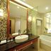 Taizhou Chunlan Hotel in Taizhou bathroom with glass shower, soaking tub, vessel sink and mirror