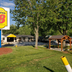 Super 8 by Wyndham Asheville/Biltmore exterior with sign, lawn, trees and gazebo in Asheville
