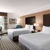La Quinta Inn & Suites by Wyndham Bakersfield North guest room with two beds and desk in Bakersfield