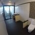 Lipe Sunset Beach Resort Ko Lipe bathroom with toilet, sink, tiled wall, and frosted glass shower door