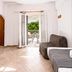 Cyclades Beach Apartments in Platis Gialos, apartment interior with open doors to a balcony and sea view