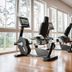 Strandhotel Dünenmeer gym in Ostseebad Dierhagen with exercise bikes, treadmills and floor-to-ceiling windows